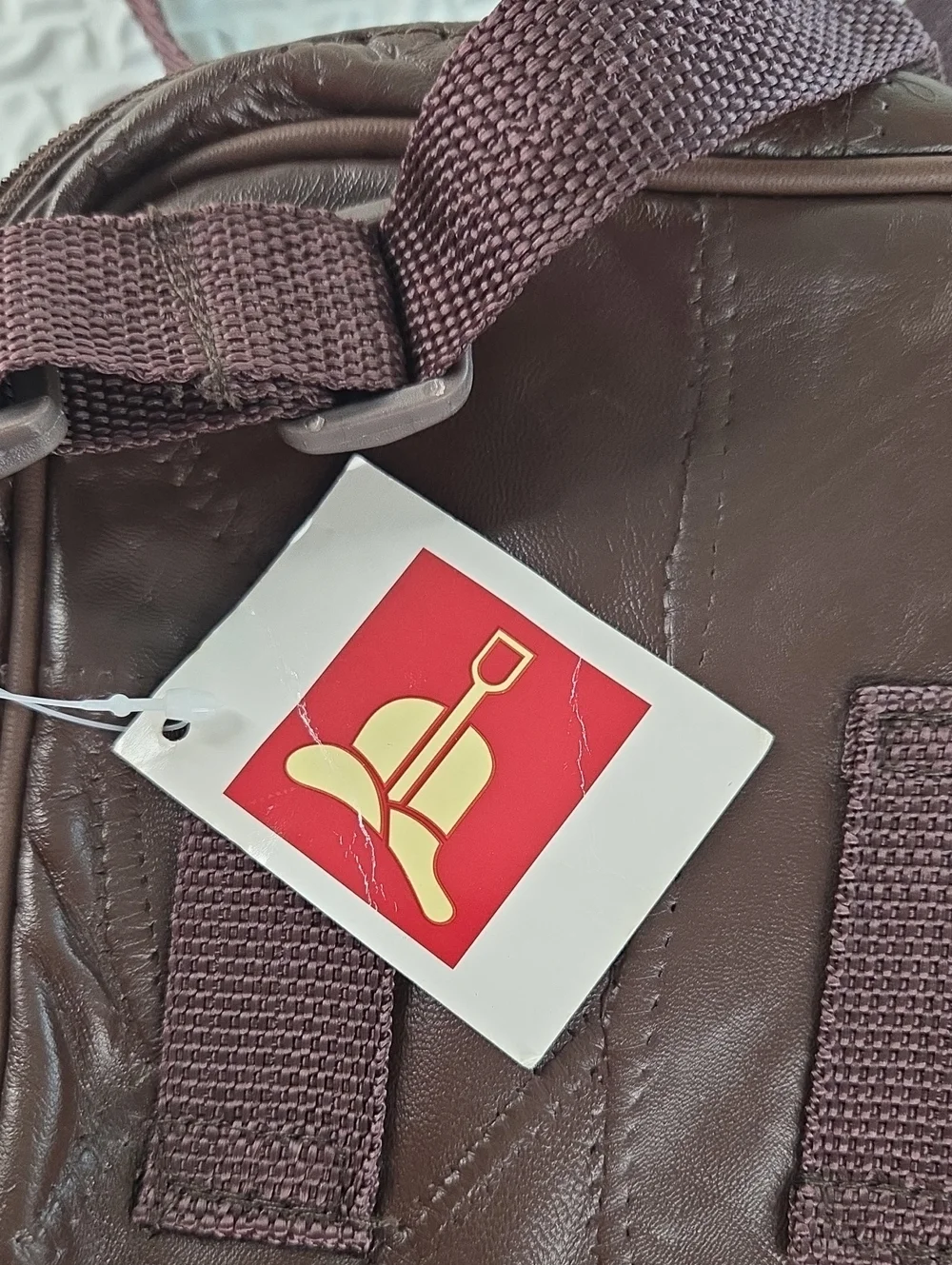 Crossbody MENS SLING BAG.Brown. English Leather PVC. RAIN RESISTANT